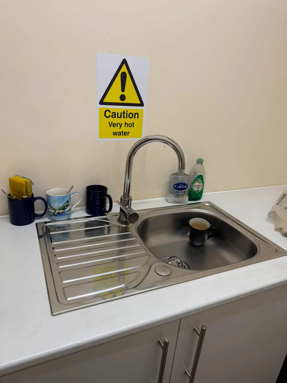 Clean workplace kitchenette and sink area