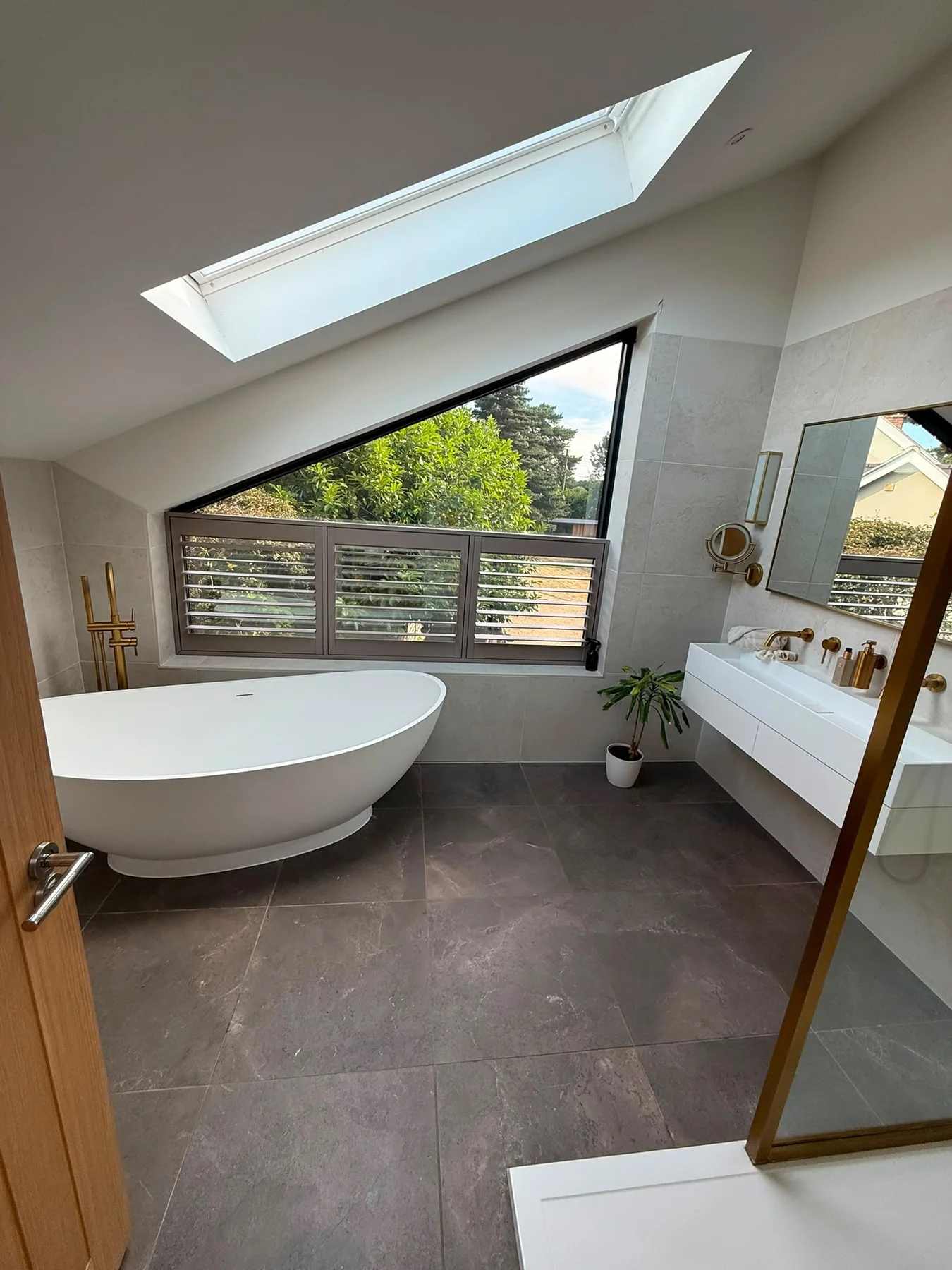 Bright bathroom with bath and skylight