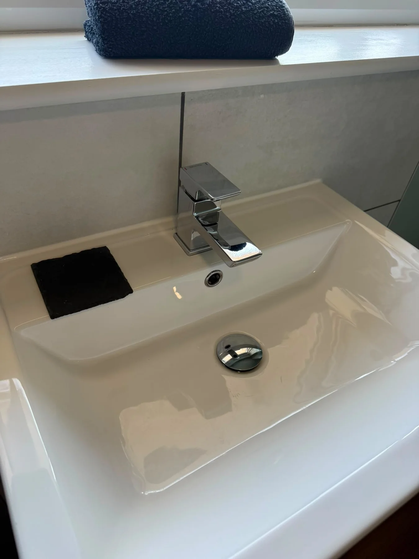 Polished bathroom basin and taps