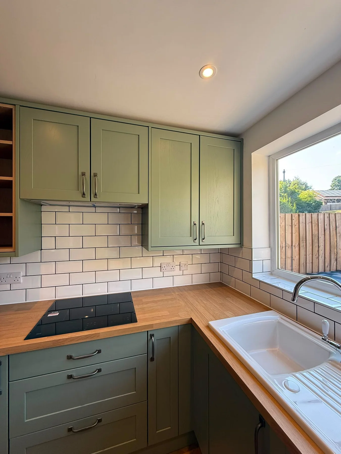 Freshly cleaned green kitchen and worktops