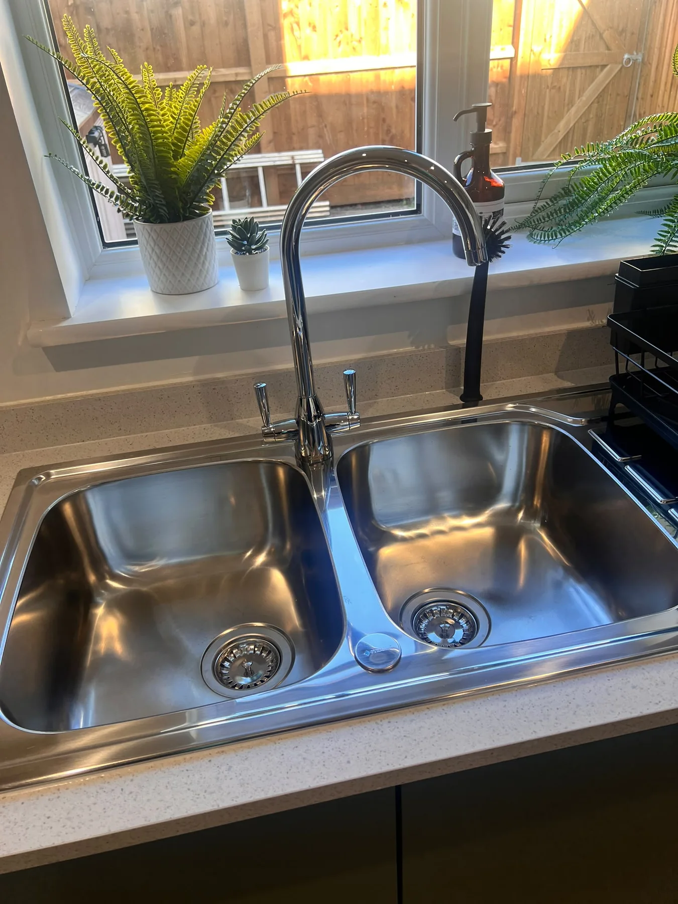 Polished kitchen sink and taps